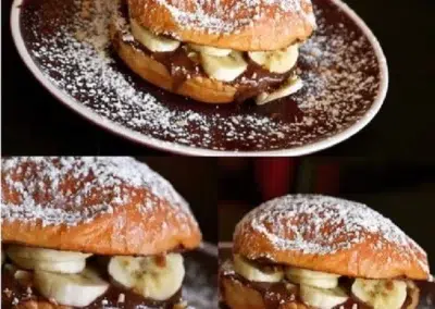 Croissant garni de chocolat et bananes, saupoudré de sucre glace.
